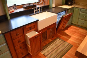 paneled garbage pullout and hidden dishwasher panel