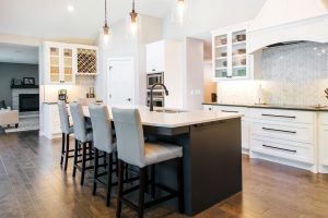 White Painted, shaker style Kitchen and Stained Island