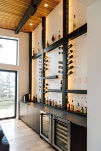 Modern Frameless Alder bar with unique custom wine bottle holder.