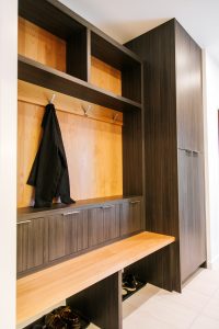 frameless Greigio Note laminate with Alder top and backboard bench and coat storage.