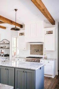 Wood hood painted with glass upper sides cabinets, pot filler faucet, shaker style cabinet doors