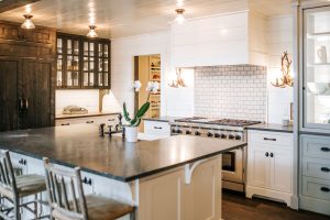 Two Toned Inset Kitchen Cabinetry with shiplap hood and painted hutch