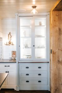 Sliding glass door hutch painted Oyster with inset doors below.