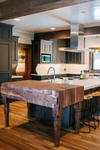 Rustic oak skip sawn island with butcher block, floating shelves and rustic Alder painted inset cabinet perimeter
