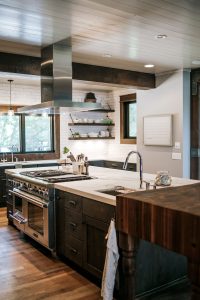 Rustic oak skip sawn island with butcher block, floating shelves and rustic Alder painted inset cabinet perimeter
