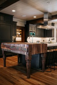 Rustic oak skip sawn island with butcher block, floating shelves and rustic Alder painted inset cabinet perimeter