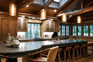 Distressed Rustic Hickory kitchen cabinets with shiplap panel inserts and wire mesh uppers and farm sink