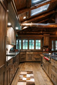 Distressed Rustic Hickory kitchen cabinets with shiplap panel inserts and wire mesh uppers and farm sink