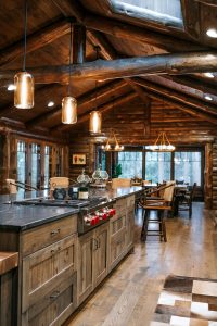 Distressed Rustic Hickory kitchen cabinets with shiplap panel inserts and wire mesh uppers and farm sink