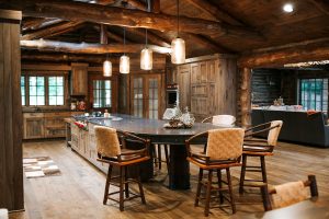 Distressed Rustic Hickory kitchen cabinets with shiplap panel inserts and wire mesh uppers and farm sink