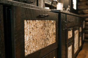 Close up of bark panel insets on cabinet doors