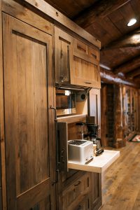 Appliance Cabinet, full overlay rustic hickory with pocket doors and Aventos lift door