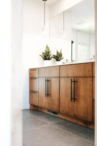 Book Match vertical grain rustic maple vanity with black bar pulls
